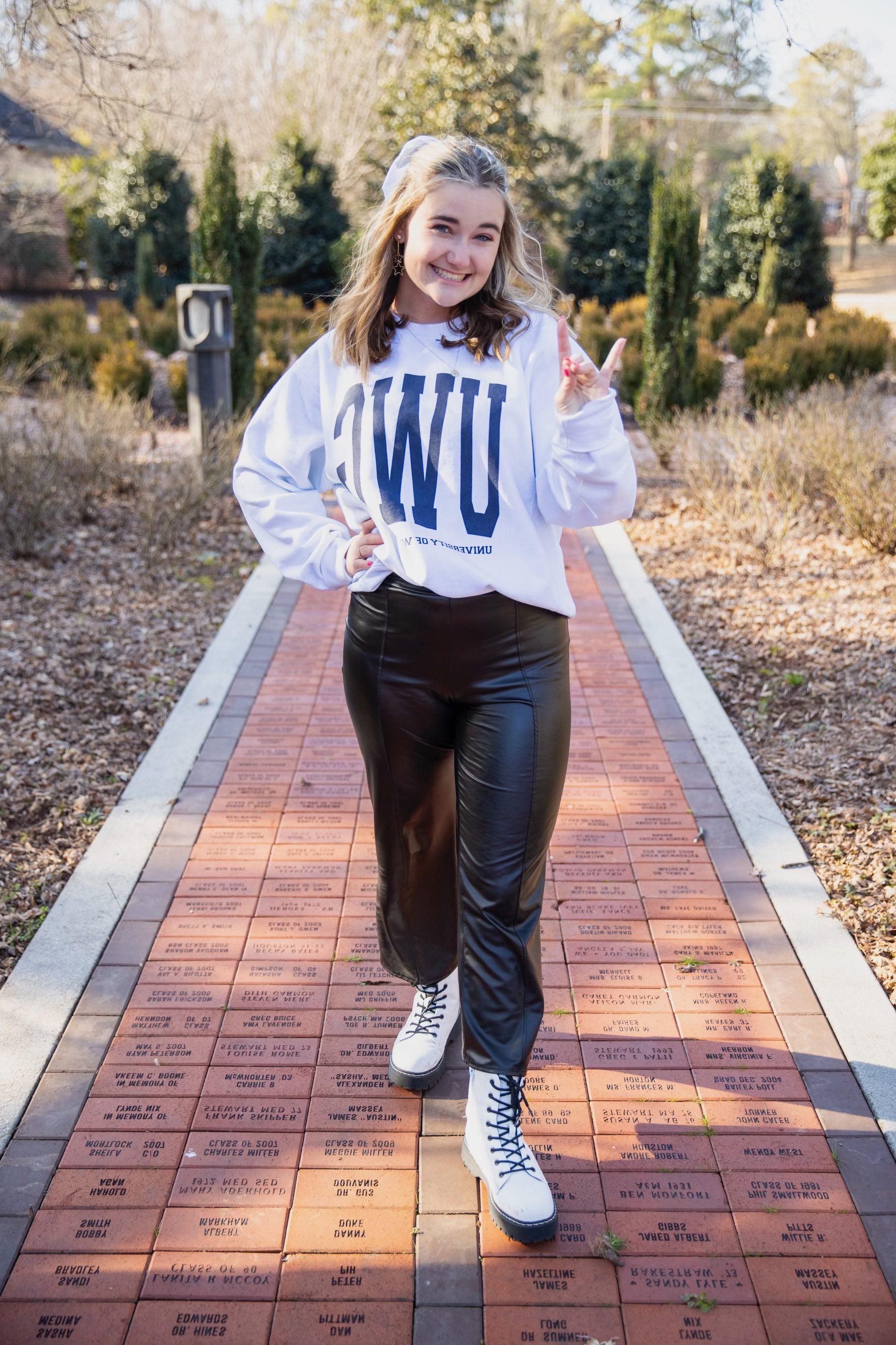 Tabitha Martin posing for an outside portait in the alumni garden.